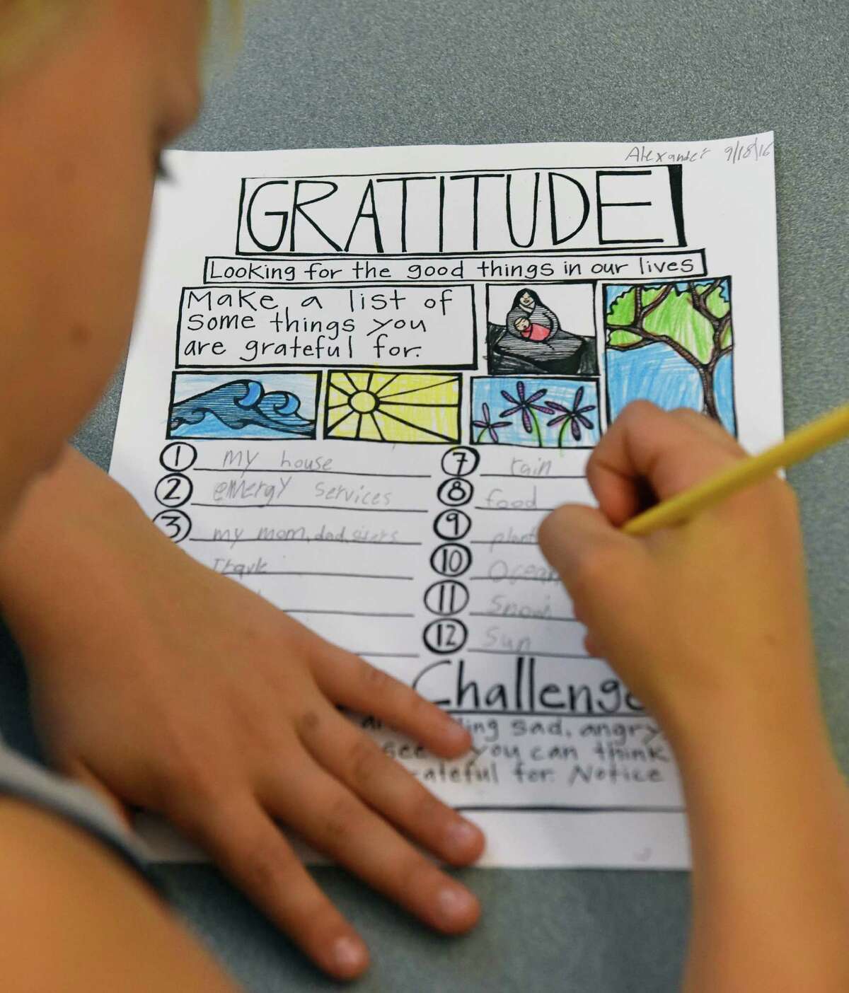 Fourth-grader Alexander Harpoth writes a list of things he is grateful for during a mindfulness exercise at Cos Cob School in the Cos Cob section of Greenwich, Conn. Wednesday, Sept. 28, 2016. Fourth-grade teacher Heather Lemelin is one of many teachers in the district who is working to bring the practice of mindfulness into the classroom. Lemelin uses the practice to help deal with the variety of learning styles and behaviors of her students and to alleviate student conflicts.