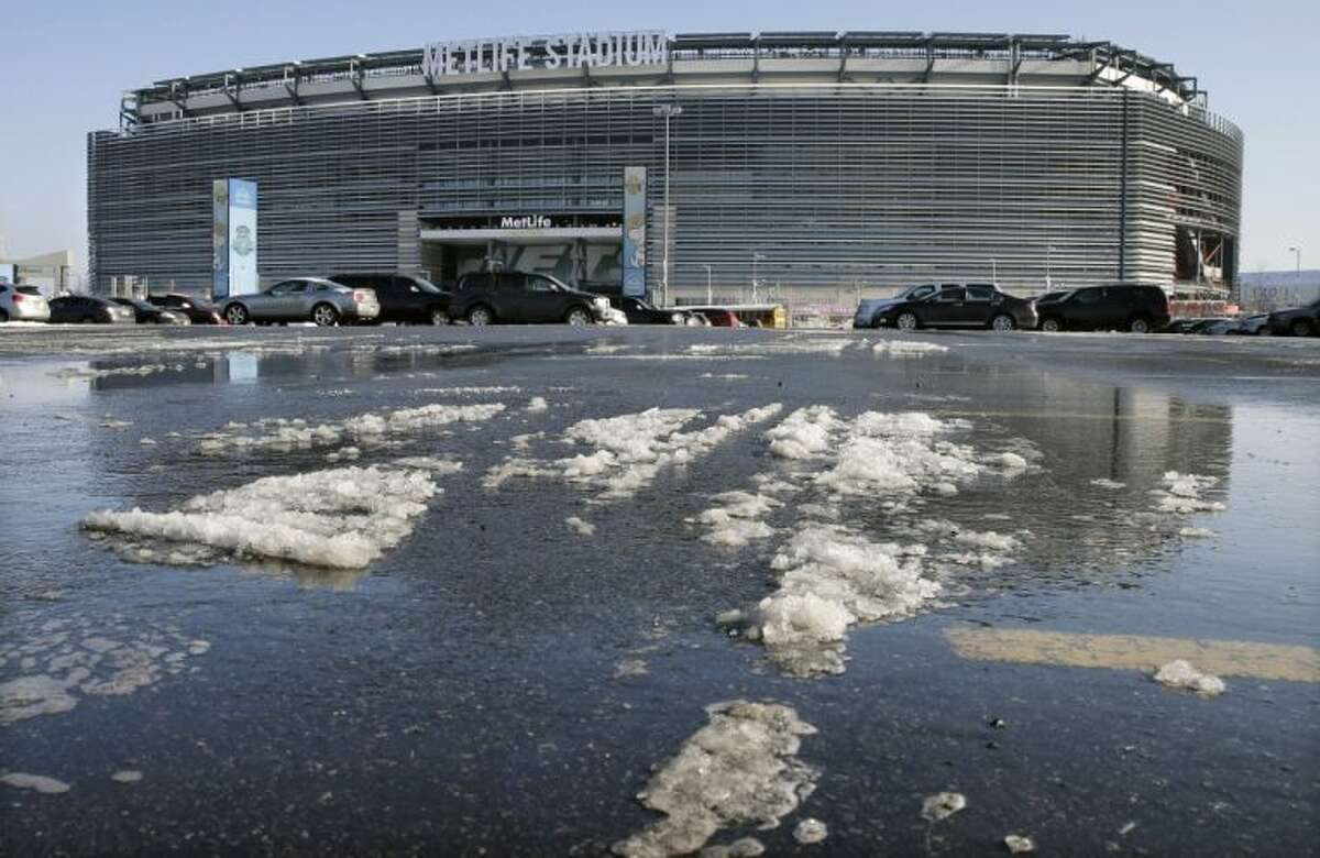 Snow and slush from Tuesday’s snowfall is seen outside MetLife Stadium on Wednesday in East Rutherford, N.J. Later in the day, officials demonstrated snow removal and melting machinery and outlined emergency weather scenarios and contingency plans for the Super Bowl in February.