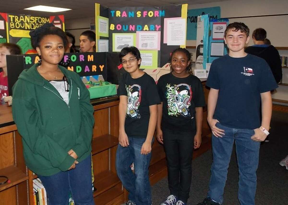 Pictured near their project, which was featured at the Houston Museum of Natural Science are students (from left) Paula Ejim, Hriday Bhatia, Christine Amaefule, and Conner Cline. (Not shown are team members Paul Anderson, Truth Thomas, Bryan Yu and Ezra Washington.)