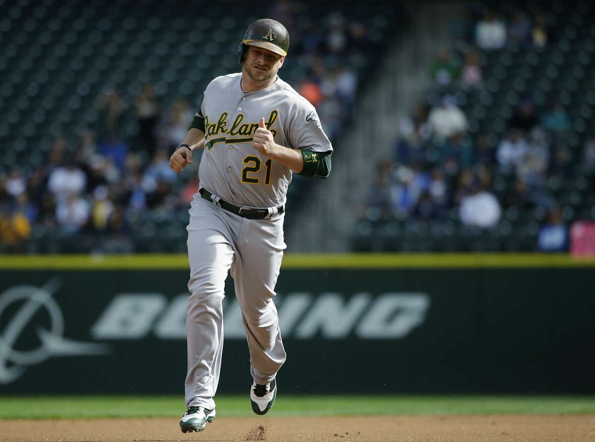 Oakland Athletics' Stephen Vogt rounds the bases after hitting a solo home run in the first inning of a baseball game against the Seattle Mariners, Sunday, Oct. 2, 2016, in Seattle. (AP Photo/Ted S. Warren)