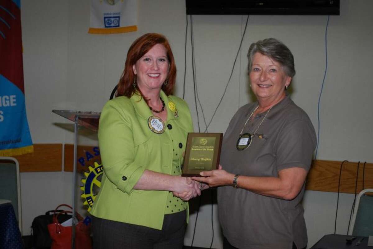 Long time Rotarian, Sherry Bufkin, (R) is honored by Pasadena Rotary’s President Dana Philibert as Rotarian of the Month for October. Sherry takes a leadership role in nearly all of the Club’s projects, including the Annual Fish Fry and Auction. A big worker in the Community, she and her husband, Roy, are noteworthy especially at Christmas time as they open their beautifully decorated home on Lilac, much to the joy of visitors from Pasadena and surrounding areas. Money collected on each table during the month will be used to benefit the Life Bridge Baptist Church’s “Celebrate Recovery” project.