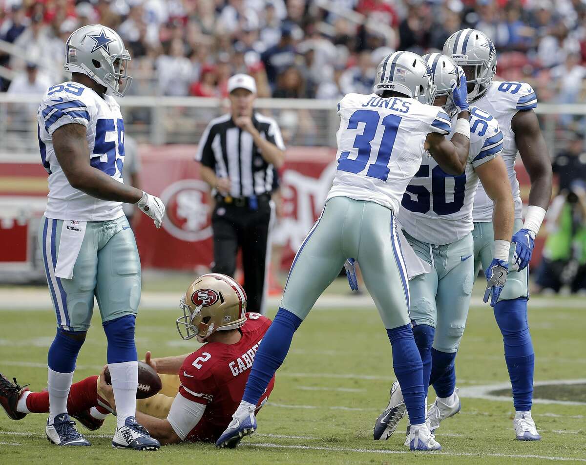 Byron Jones (31) and Sean Lee (50) celebrate Lee's sack of Blaine Gabbert (2) in the first half as the San Francisco 49ers played the Dallas Cowboys at Levi's Stadium in Santa Clara, Calif., on Sunday, October 2, 2016.