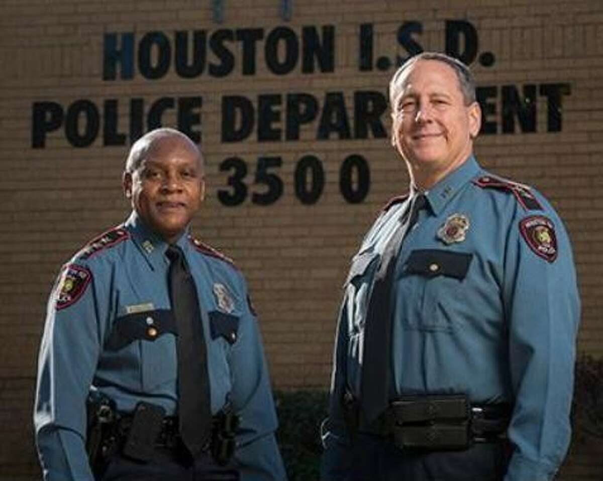Houston ISD Chief of Police Jimmy Dotson, left, with his successor, Assistant Chief Robert Mock.
