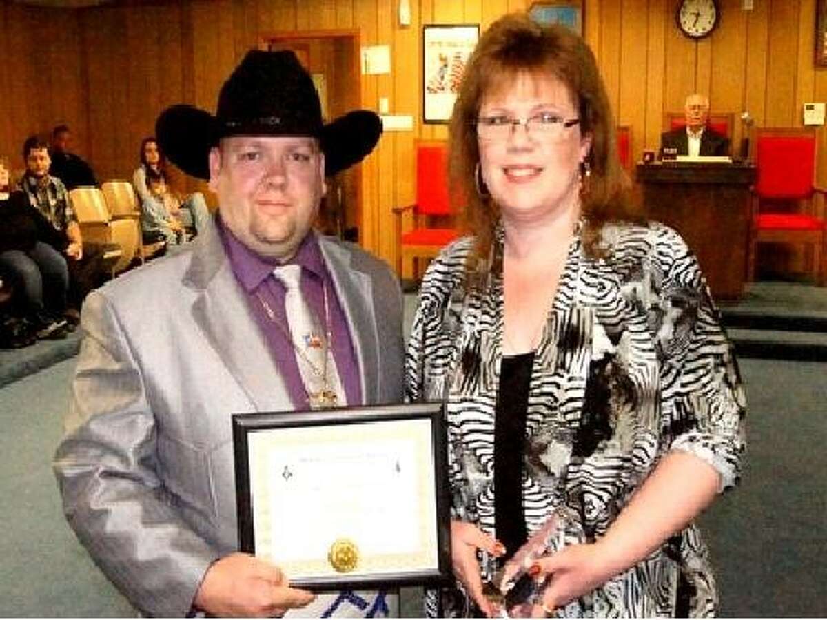 During a special ceremony, Jamie Nash, right, received the 2014 Community Builder Award from Worshipful Master Stephen Carlisle during a special ceremony at the Sam B. Crawford Masonic Lodge in New Caney Jan. 25, 2014.