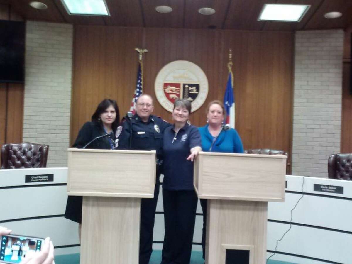 Charlene Nall, Sgt. Gorman of Tomball Police Dept., Cheryle Lapsley and Kathy Bogs stands next to the two podiums the TPCCA donated to the TPD on Monday Jan. 27.
