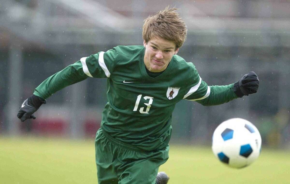 The Woodlands’ Baker Smith heads the ball Friday against Brandeis in the Kilt Cup.