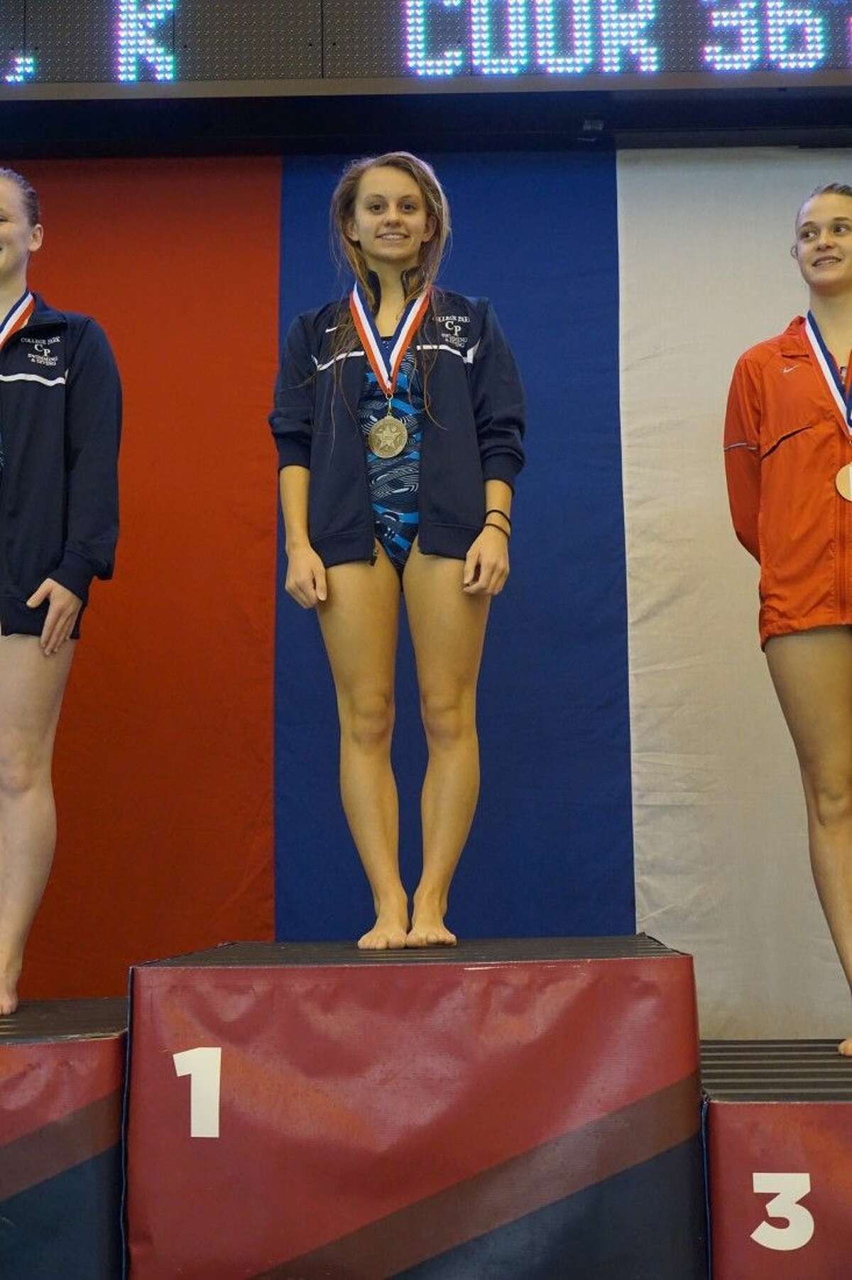 College Park’s Emma Dellmore finished first in the girls 1-meter diving competition.