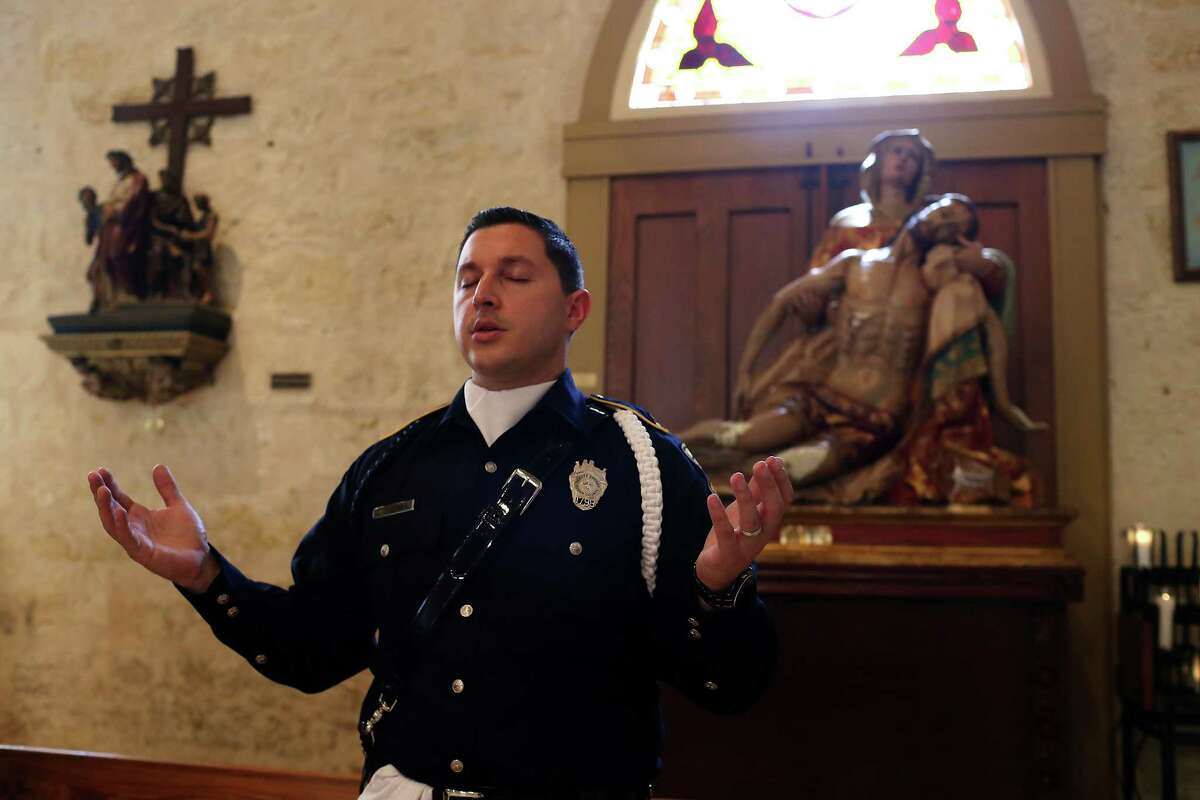 Bexar County Sheriff Deputy Jesus Guerra participates in the annual Blue Mass at San Fernando Cathedral, Thursday, Sept. 29, 2016. Members of law enforcement agencies from the San Antonio Police Department to the Department of Homeland Security attended the service.