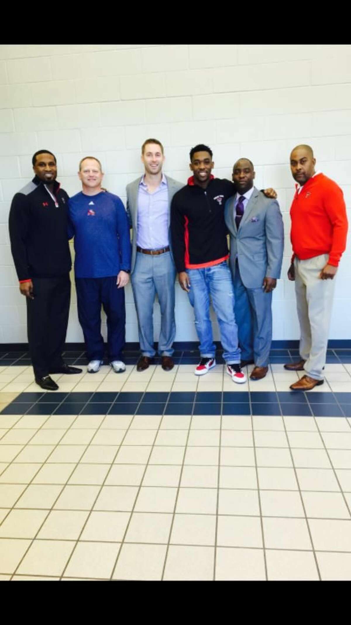 Atascocita WR Quan Shorts gets special visitors including Texas Tech head football coach Kliff Kingsbury and running backs coach Mike Jinks on Tuesday at Atascocita High School. 