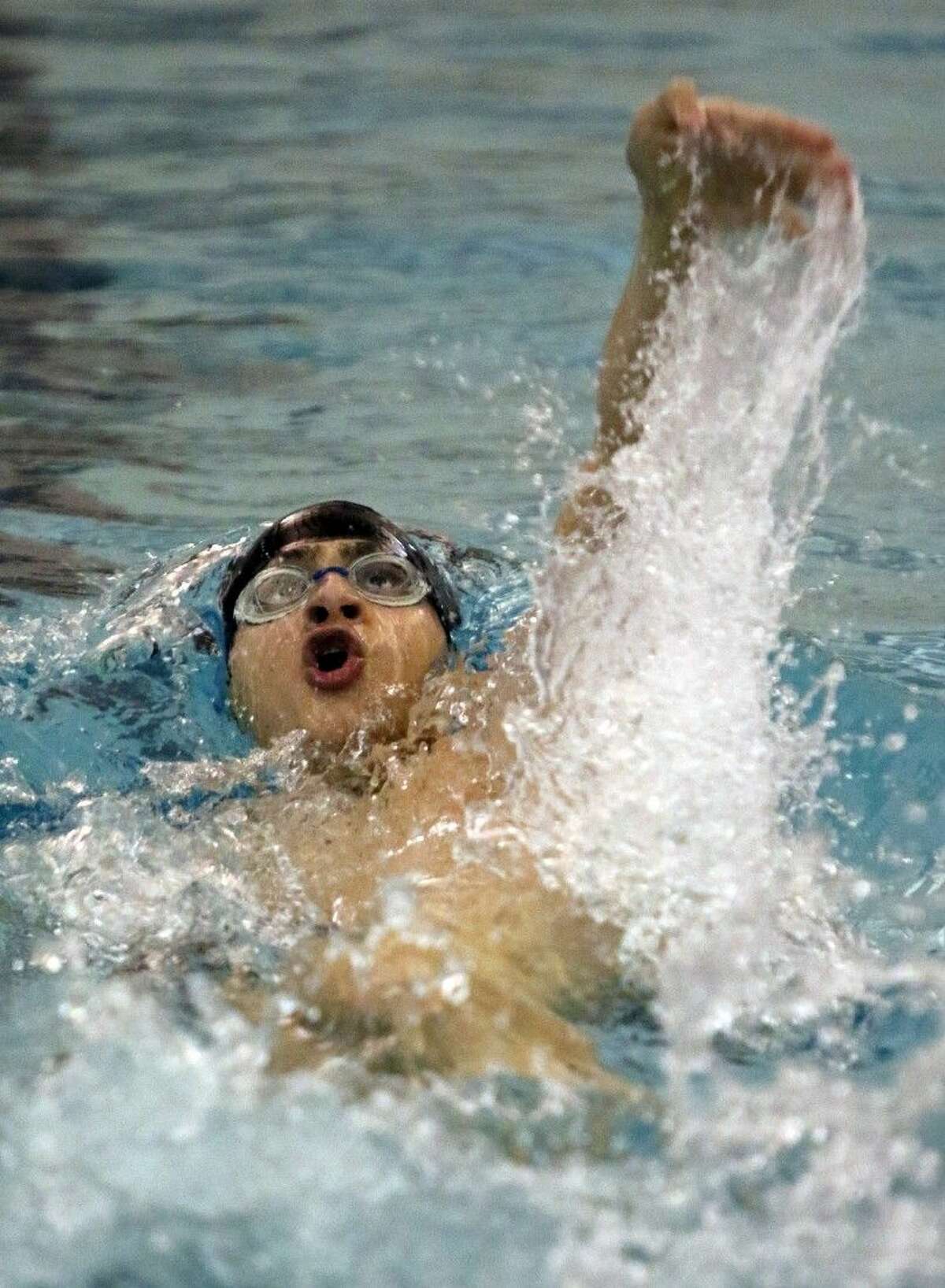 Cinco Ranch's Alex Smilenov swims in the Boys 100 Yard Backstroke at the Duel In The Pool swim meet Jan. 10 at Katy High School in Katy. To view or purchase this photo and others like it, go to HCNPics.com.