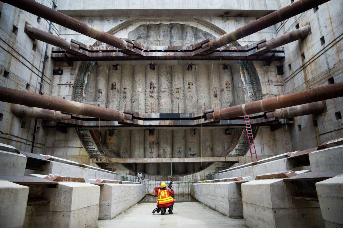 Associated Press photographer Ted Warren photographs Bertha's exit wall in the extraction pit, Monday, Oct. 3, 2016.