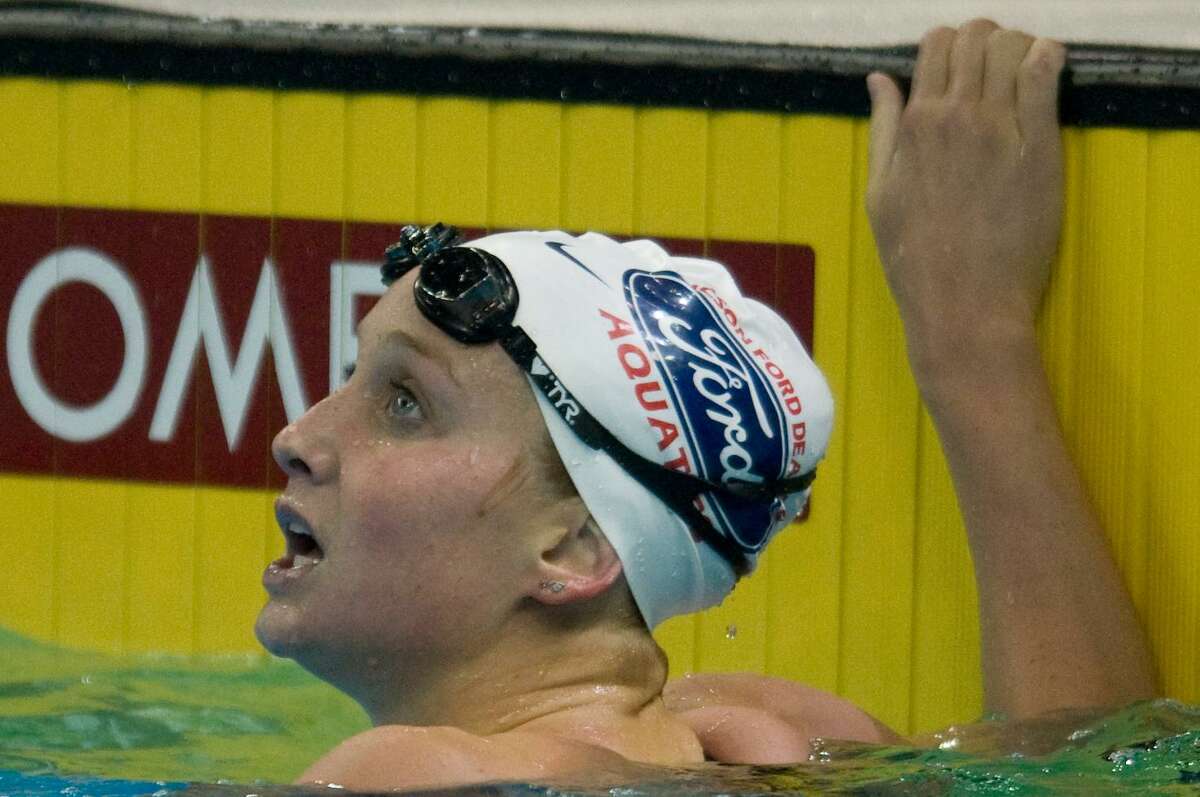 Annie Chandler looks at her time during the 100-meter breaststroke finals of the 2008 H.S. Olympic Swimming Trials in Omaha, Neb., on July 1.
