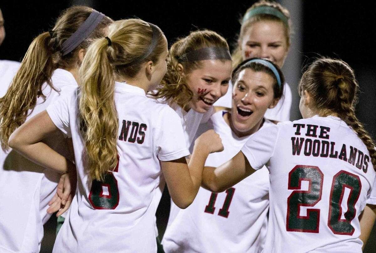 The Woodlands' Sommer Stanley celebrates with teammates after scoring a goal against Summer Creek Friday.