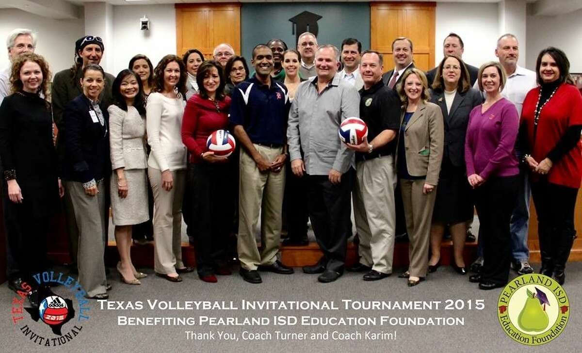 The Pearland ISD Education Foundation Board of Directors and PISD Head Volleyball Coaches John Turner and Jason Karim.