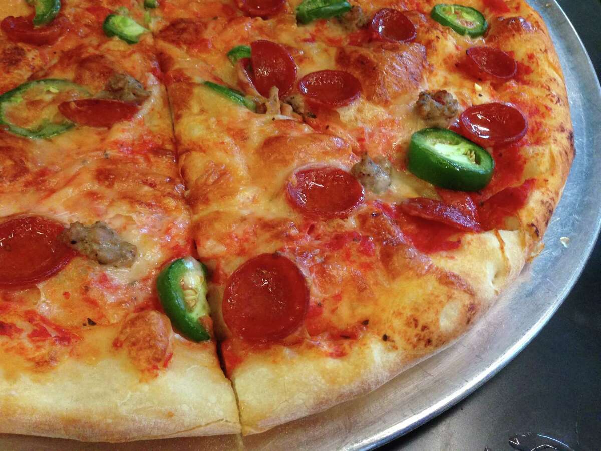 Lee's Pizza at Pi Pizza has pepperoni, house-made Italian sausage and fresh jalapenos.