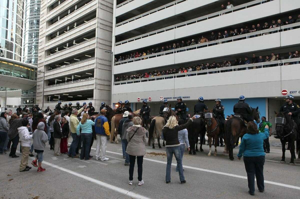 The HPD Mounted Patrol demonstrates a mock crowd management scenarios on the streets of downtown Houston, Texas on Saturday, March 7, 2015. The demonstration was part of a two-day North American Mounted Unit Commander's Association conference, hosted by the Houston Police Department, for mounted units from across the United States and Canada. To view or purchase this photo and others like it, go to HCNPics.com.