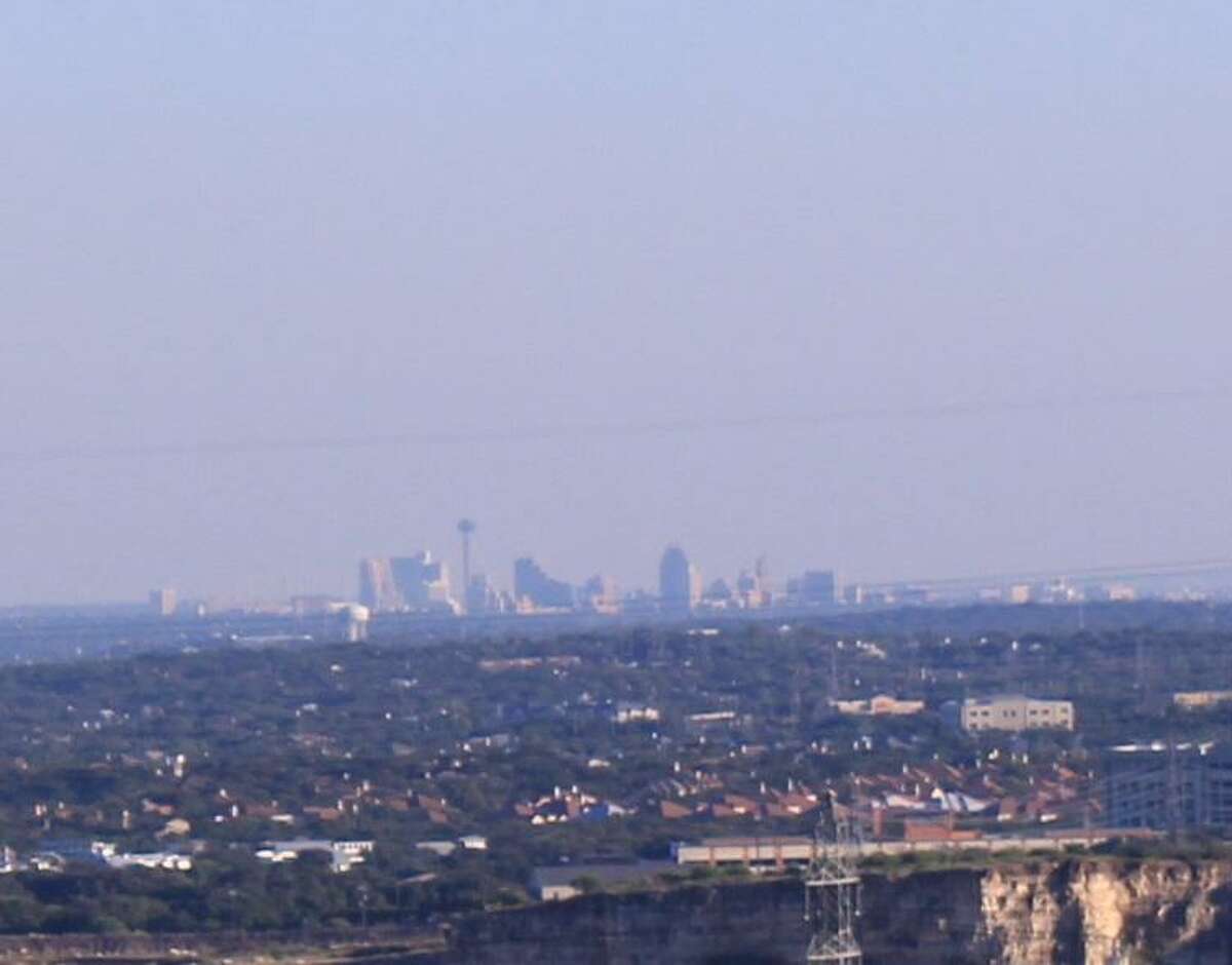 The downtown San Antonio skyline looks hazy from Eisenhower Park on Oct. 2, 2016, the day of a late-season spike in ozone levels. Officially, the city’s levels have been below unsafe levels. In reality, not so much.