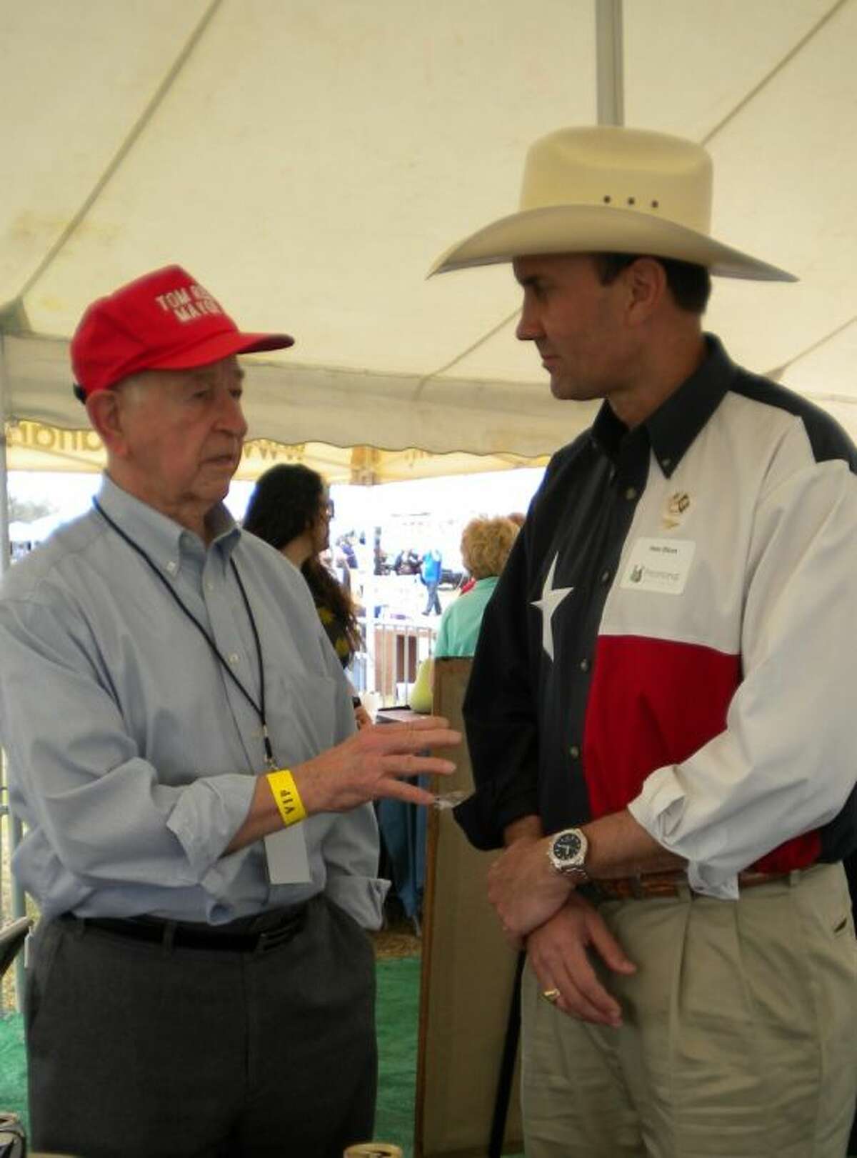 Pearland Mayor Tom Reid, left, talks with U.S. Rep. Pete Olson at a crawfish festival.