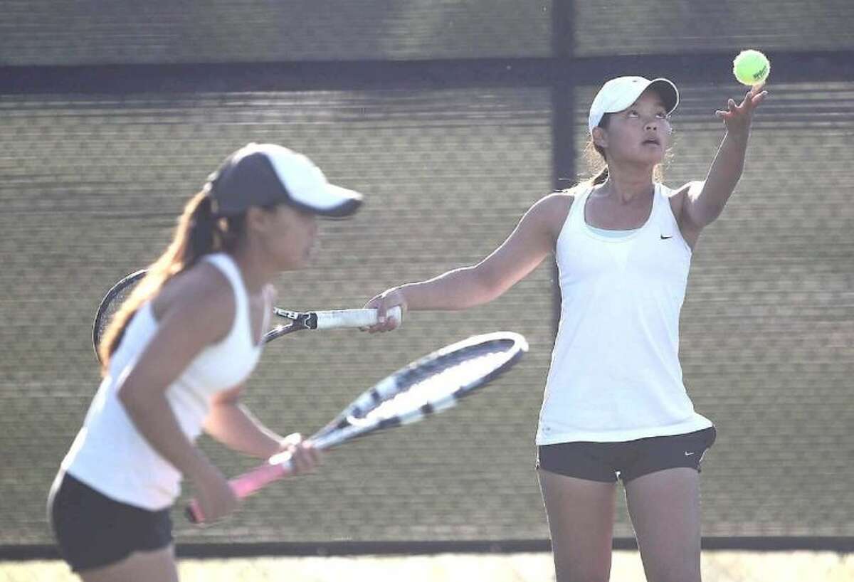 Friendswood's Brittany and Kaitlyn Vu compete in the third round of girls doubles in the Region III-4A regional tennis tournament Wednesday.
