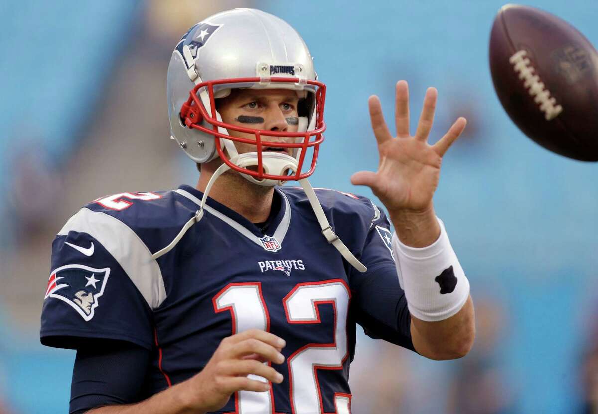 New England Patriots quarterback Tom Brady warms up prior to