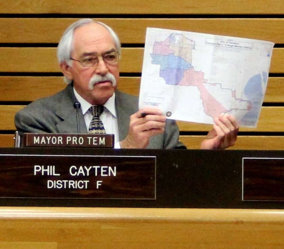 Pasadena City Councilmember Phil Cayten held up the new city district map during the meeting and voiced his support. "I’m going to stand by these numbers. If anyone needs to look at these numbers, we have the information. Call the City Secretary and look at the maps yourself."