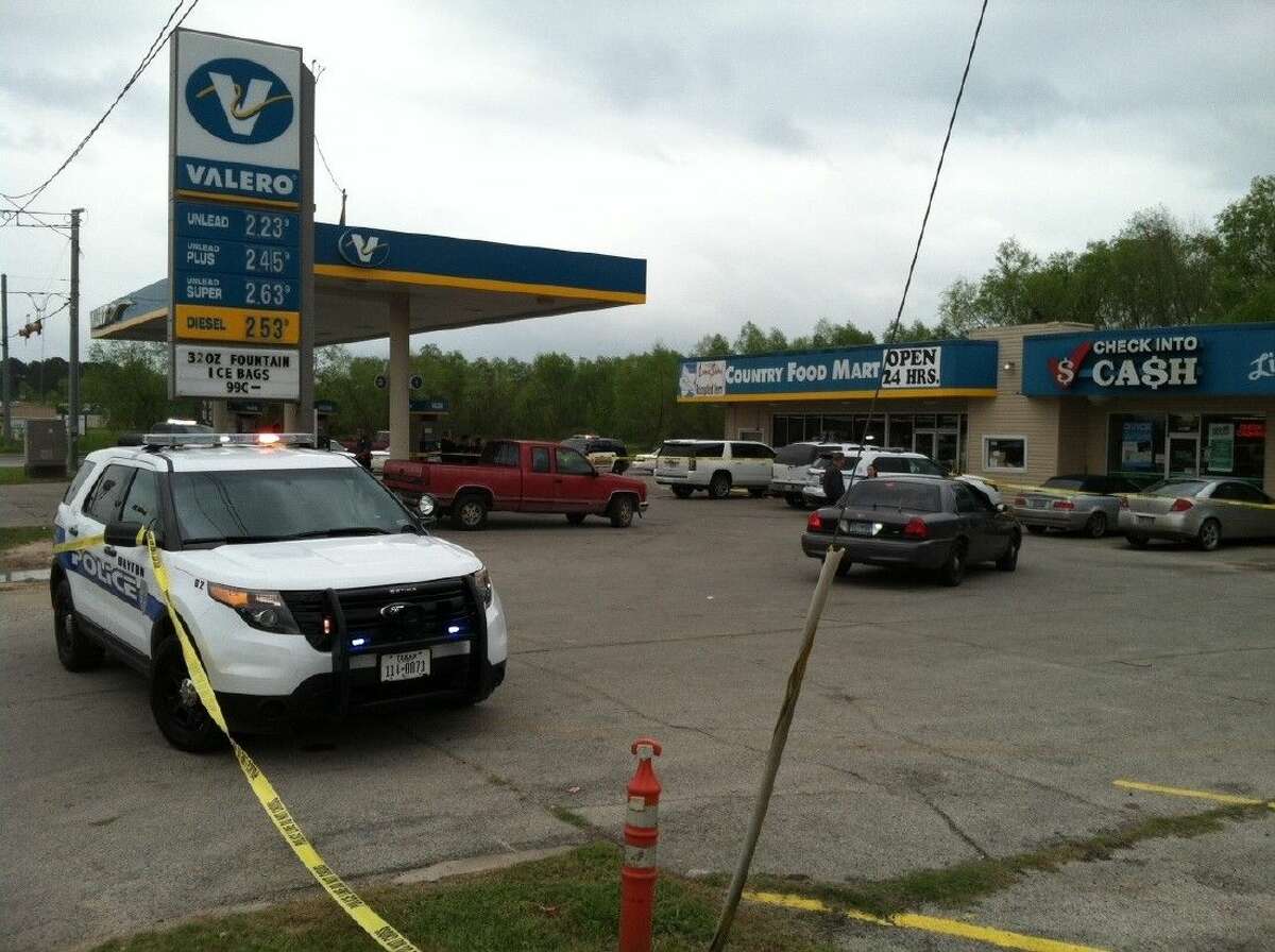 Crime scene tape blocks off the entrances into Valero gas station on US 90 at Main St. in Liberty where an officer-involved shooting took place around 11:30 a.m. Friday.