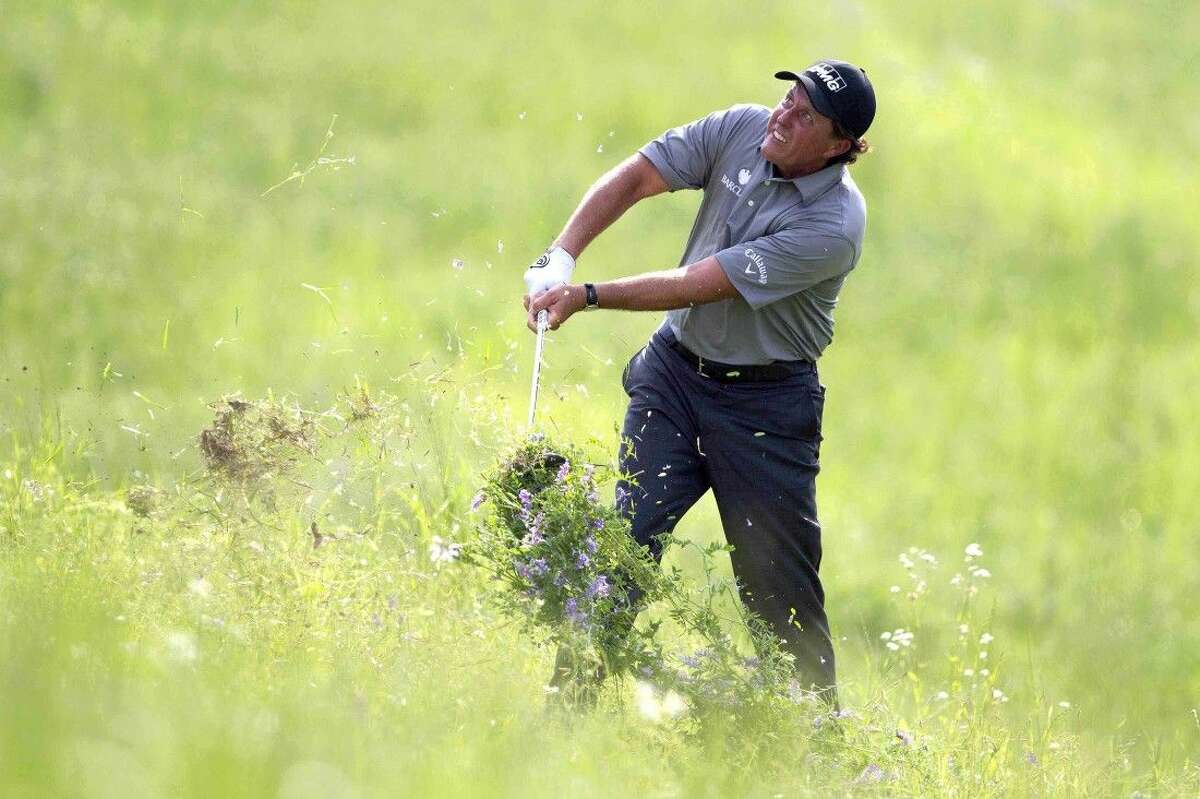 Phil Mickelson hits out of the rough for his second shot on the 17th hole during the second round of the Shell Houston Open at the Golf Club of Houston on Friday in Humble.