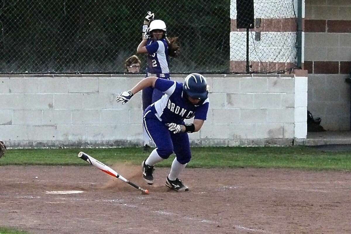 Alexis Trousdale heads to first on a bunt in the fourth inning, Tuesday, April 7, 2015.