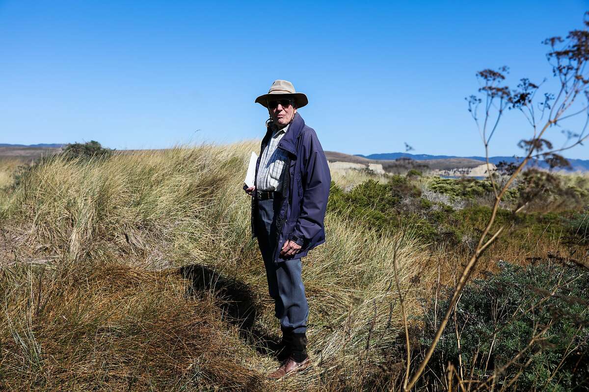 Historian and President of the Drake Navigators Guild, Edward Von Der Porten stands in tall grass at Drake's cove while giving a tour of the area, in Inverness, California, on Tuesday, September 27, 2016.
