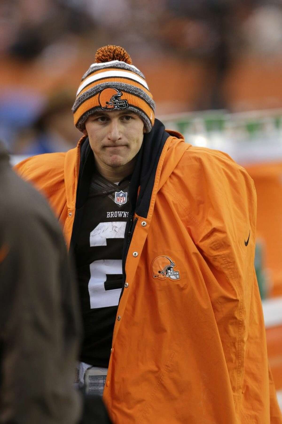 FILE - In this Dec. 14, 2014 file photo, Cleveland Browns quarterback Johnny Manziel watches from the sidelines in the fourth quarter of an NFL football game against the Cincinnati Bengals in Cleveland. A person familiar with the situation says Manziel has been released from a rehab facility. Manziel entered the undisclosed clinic Jan. 28 for treatment of an unspecified problem. The person said he was discharged Saturday, April 11, 2015, speaking on condition of anonymity because of privacy issues. (AP Photo/Tony Dejak)