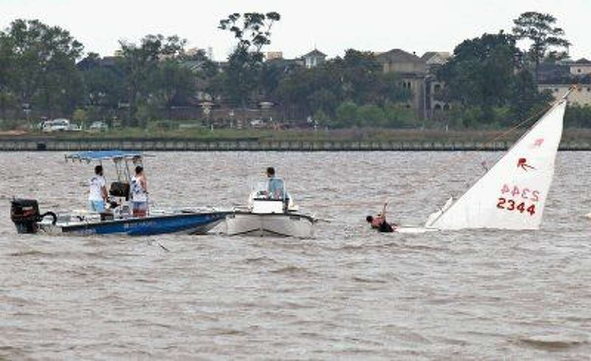 Boaters cling to hull after sailboat capsizes in Clear Lake