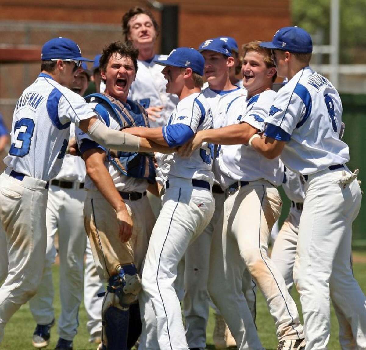 Friendswood players celebrate their win over District 24-4A rival Santa Fe, a win which sends the Mustangs into a regional semifinal matchup with Brenham Thursday and Friday in Katy.