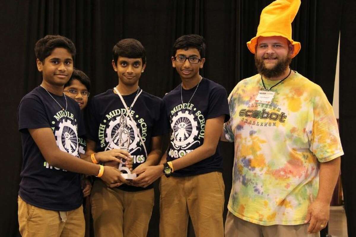 Smith Middle School students on Team Super Kings celebrate their sixth-place overall finish at the All-Earth EcoBot Challenge on May 17 at Reliant Center. Team members are Hiran Manoharan, Nachiket Vamishidhar, Manish Koleti and Saahith Matam.