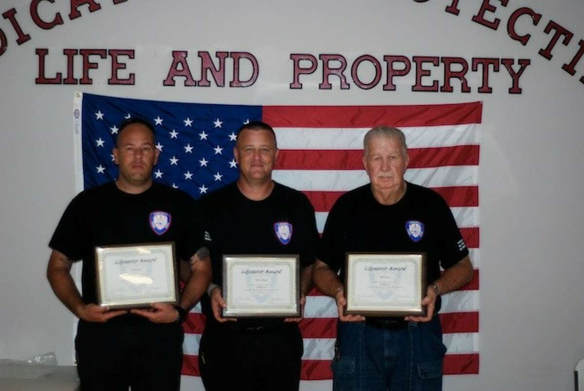Chris Reel, Steven Grimm, and H. D. Jackson pose here with their Life Saver awards.