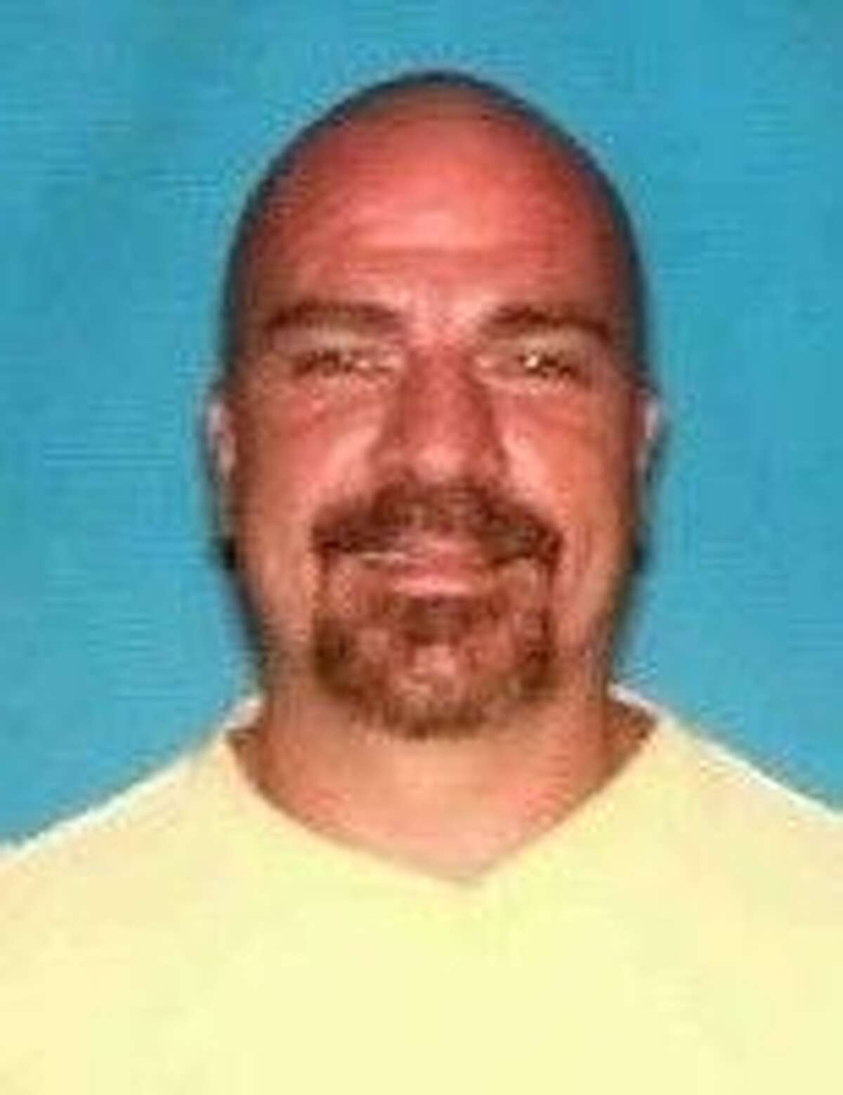 Another photo of fugitive William Joseph Greer shows him with a bald head.