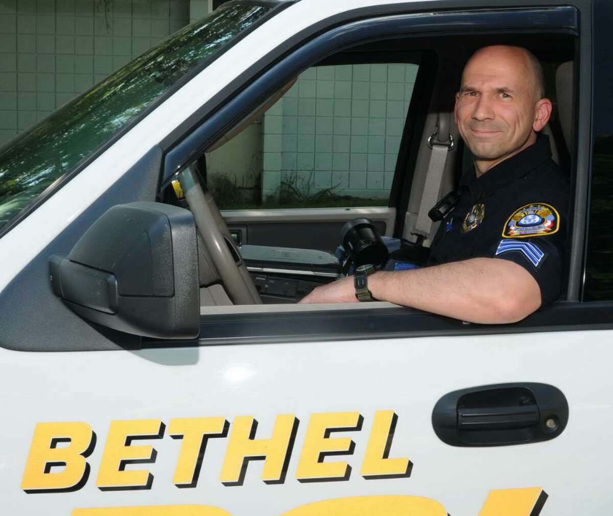 Bethel police officer, Sgt. Keith Mackenzie, in a police cruiser, at the Bethel Police Department, on Wednesday, May 5, 2010. Mackenzie has been named Bethel Police Officer of the Year by the Danbury Exchange Club, in conjuction with the Bethel Police Department.