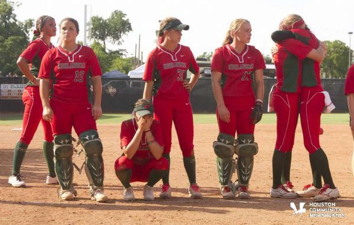 The Woodlands players reacts after a walk-off single by Katy's Kourtney Coveney in the eighth inning the gave the Lady Tigers a 3-2 win in the Class 6A state semifinal game in Austin Friday.