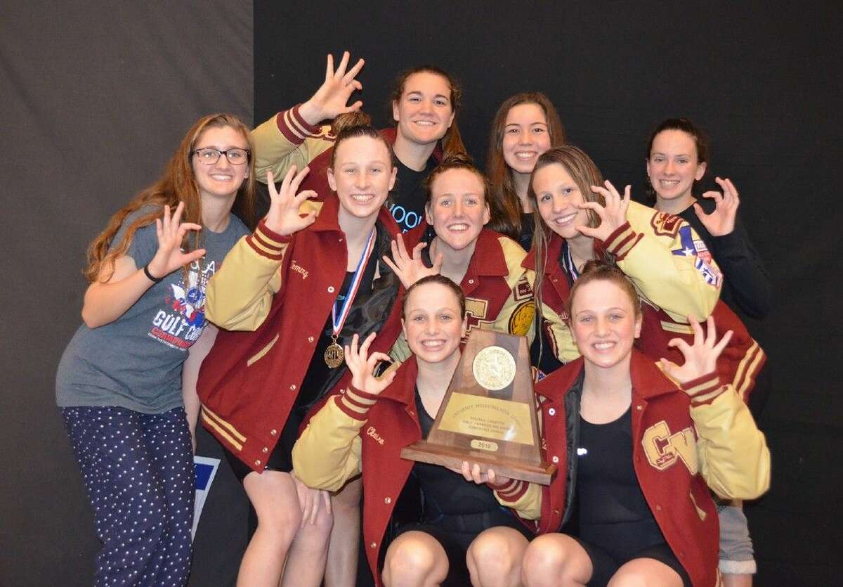 The Cypress Woods High School girls’ swimming and diving team celebrates its second consecutive Region V-6A championship on Feb. 6 at the Conroe ISD Natatorium. Pictured (bottom row, L-R) are: Kate Smith and Claire Smith; (second row) Isabelle Decker, Sydney Stanford, Mikayla Schnibben and Faith Kitzman; and (top row) Katelyn Klewitz, Caroline Giannella and Riley Smith. (Photo by Scott Smith)
