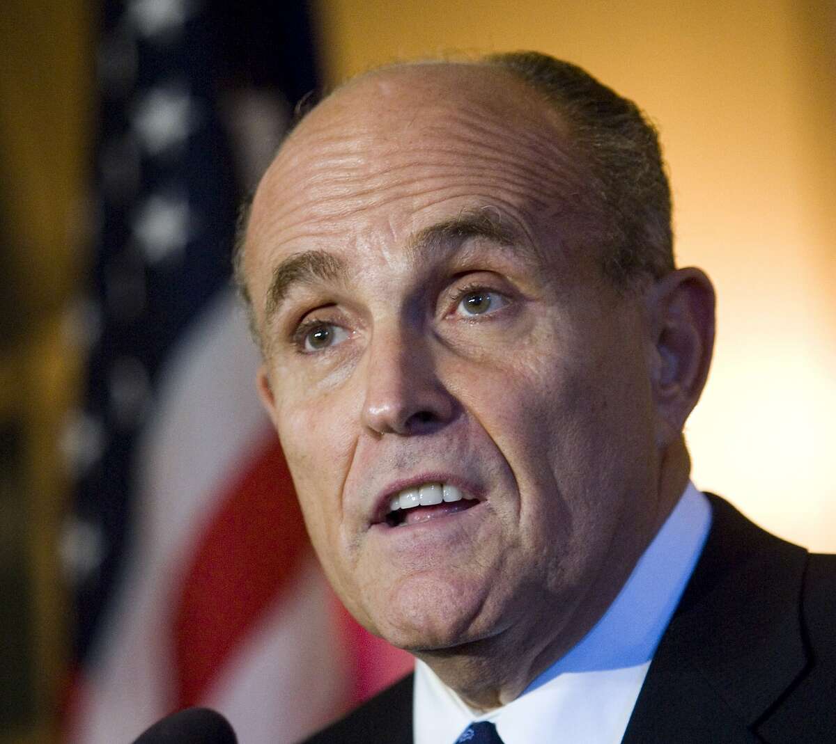 FILE - In this Oct. 18, 2007 file photo, Rudy Giuliani answers questions following a fundraiser in Milwaukee. Giuliani is giving Hillary Clinton credit for her work on behalf of victims of the Sept. 11, 2001, terrorist attacks. Giuliani was asked at a Republican Party briefing Thursday, July 28, 2016, in Philadelphia whether he took issue with the Democratic convention speakers who'd been praising Clinton. Giuliani said she was "enormously supportive and helpful." Clinton was a U.S. senator from New York at the time. 