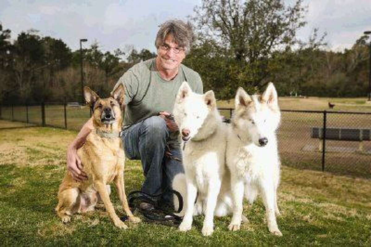 The Woodlands resident Larry Alton adopted Nina, right, and Graham, left, who are unable to see. River, center, who is also blind, is being fostered by Alton.