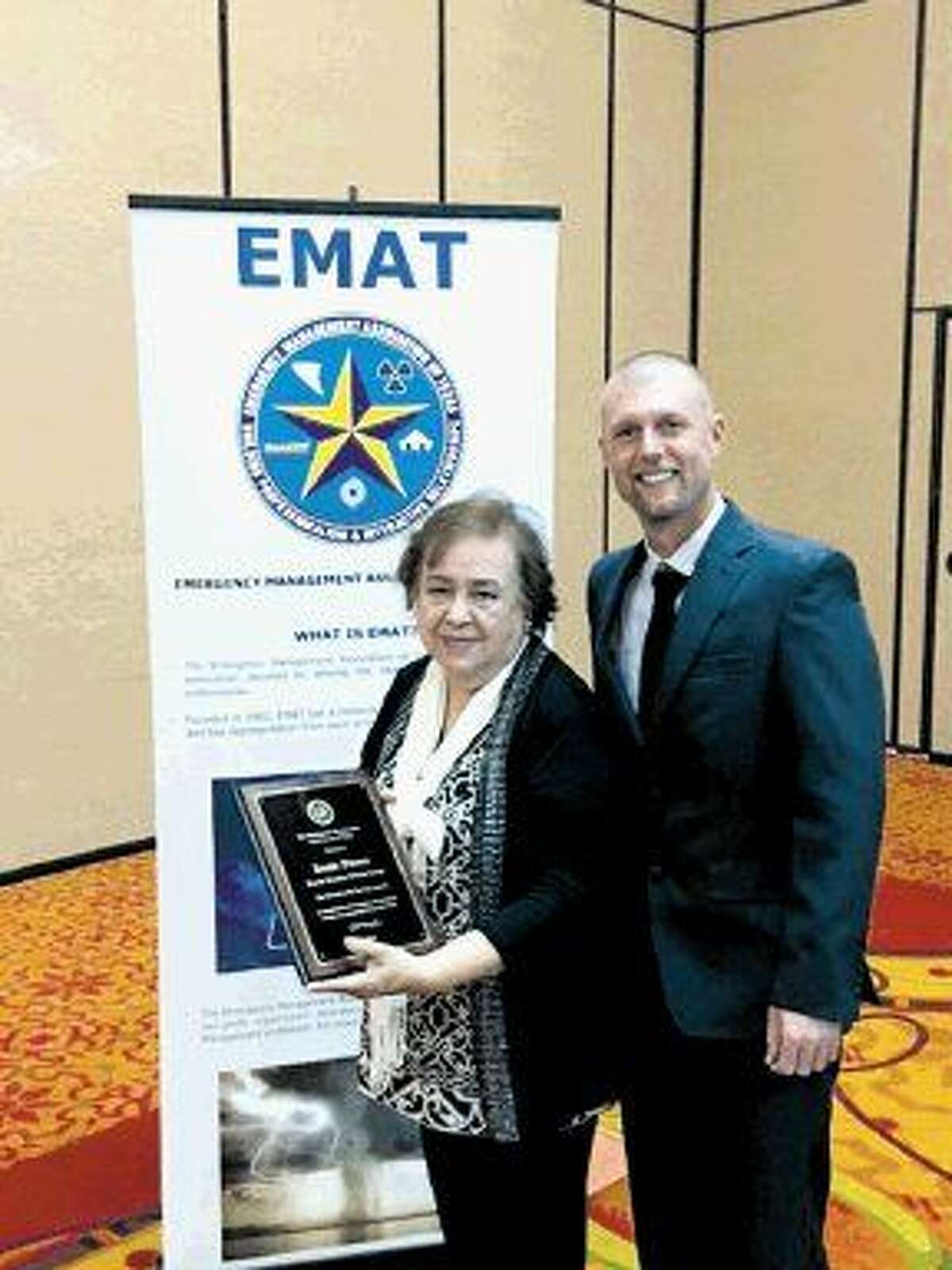 Harris County Citizen Corps Teen CERT coordinator Rosie Flores received the EMAT Community Service Award Feb. 9. Pictured from left to right are Rosie Flores, Harris County Teen CERT coordinator and Jeb Lacey, EMAT president.
