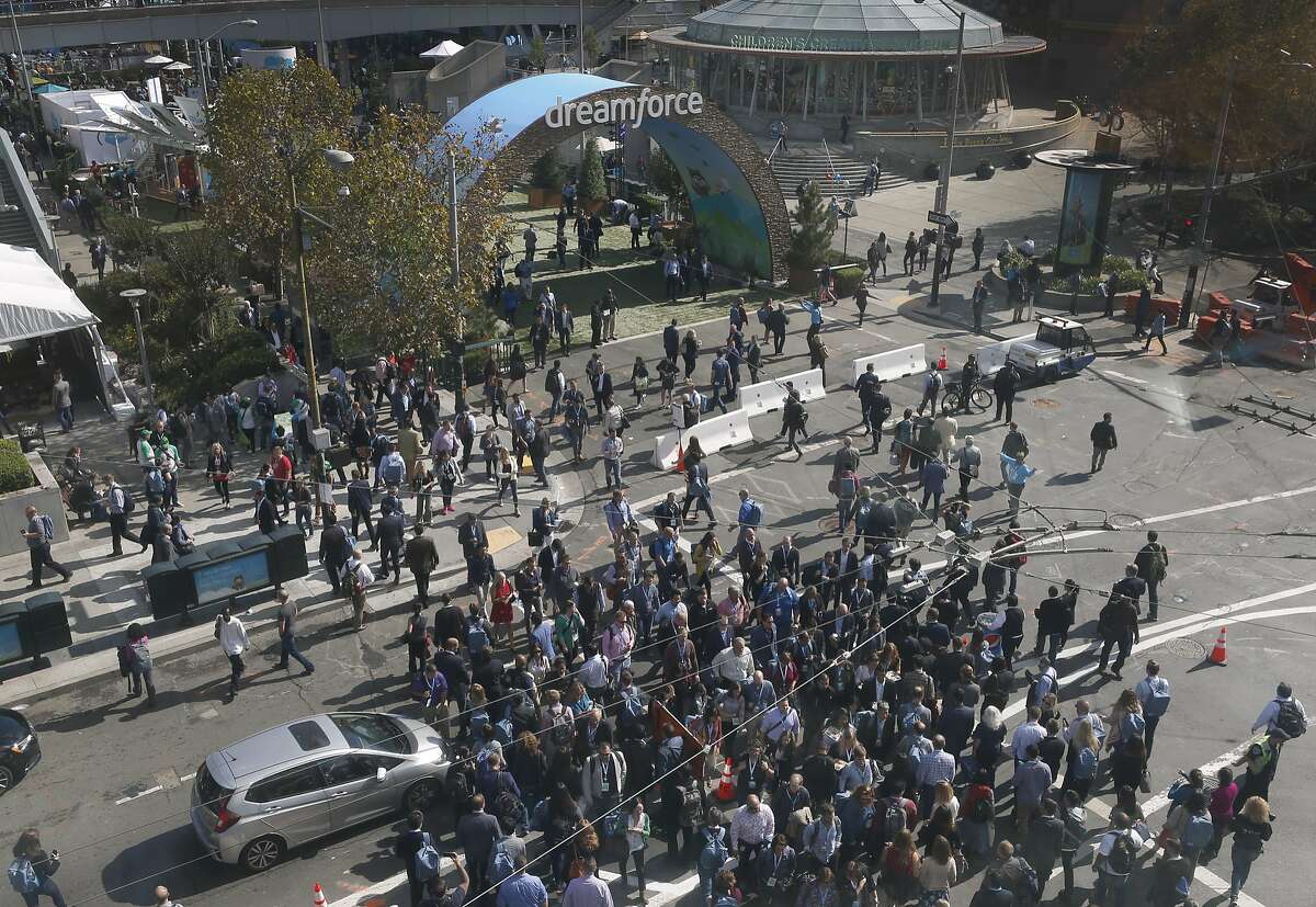Scores of Dreamforce conference-goers converge on Fourth and Howard streets for the weeklong event hosted by Salesforce at the Moscone Convention Center in San Francisco, Calif. on Tuesday, Oct. 4, 2016.