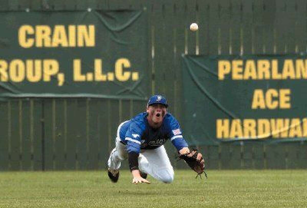 Ryan Shetter of Friendswood makes a leaping attempt to catch a ball in outfield against Deer Park Saturday.