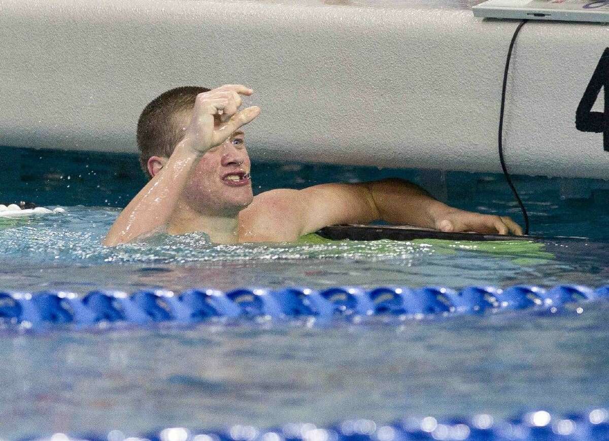 Glen Cowand, of Cinco Ranch, reacts after coming within .03 seconds of setting the state record in the boys 100-yard backstroke during the Class 6A finals of the UIL State Swimming & Diving Championships at the Lee and Joe Jamail Texas Swimming Center Saturday, Feb. 20, 2016. Go to HCNpics.com to view more photos from the state meet.