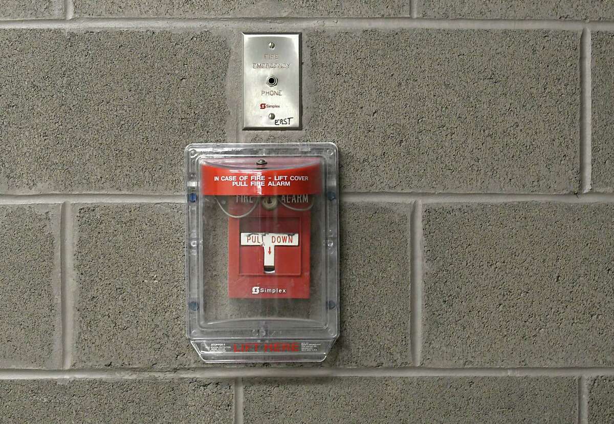 A fire alarm is seen on the wall in a hallway at the SEFCU arena at University at Albany on Tuesday, Oct. 4, 2016 in Albany, N.Y. The city of Albany is looking to fine alarm system companies that are repeat offenders of false alarms at buildings in the city. (Lori Van Buren / Times Union)