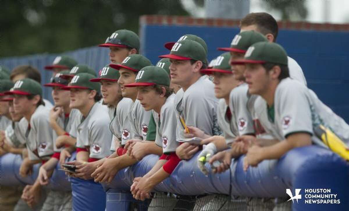 The Woodlands dugout is seen during a bi-district playoff game last year.