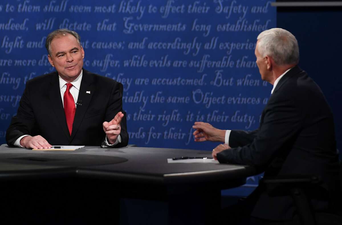 Democratic candidate for Vice President Tim Kaine and Republican candidate for Vice President Mike Pence speak during the vice presidential debate at Longwood University in Farmville, Virginia on October 4, 2016. / AFP PHOTO / Jewel SAMADJEWEL SAMAD/AFP/Getty Images