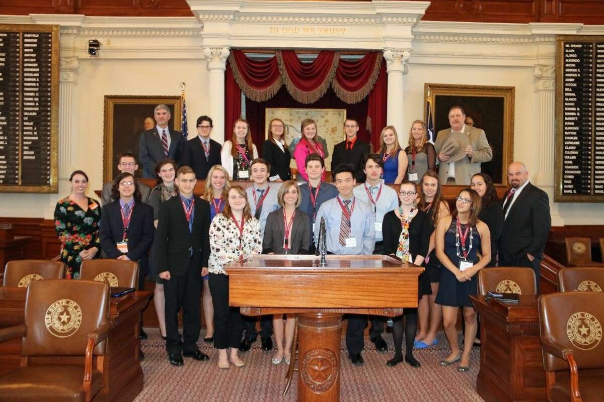 Magnolia ISD Student Leadership with Superintendent Dr. Todd Stephens and State Rep. Cecil Bell, Jr. on the House of Representatives floor on the dais.