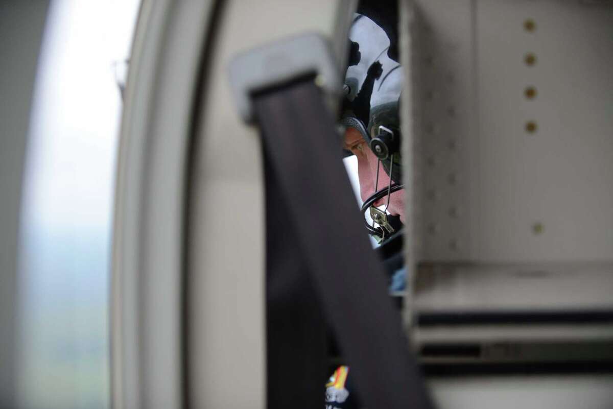 Troopers fly Bell helicopter to find pot in the fields