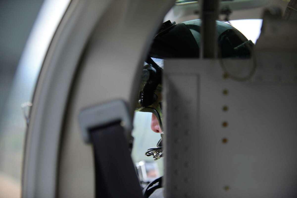 Troopers fly Bell helicopter to find pot in the fields